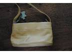 Radley handbag,  pale yellow in colour,  never used!....
